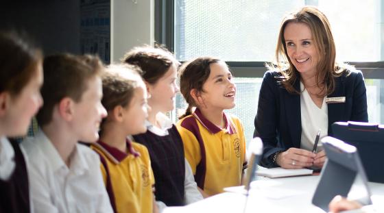 A teacher with a group of students.