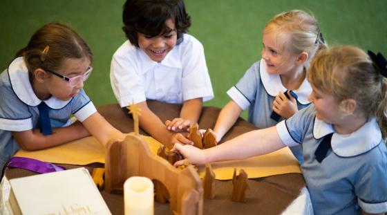 A group of students playing with blocks.